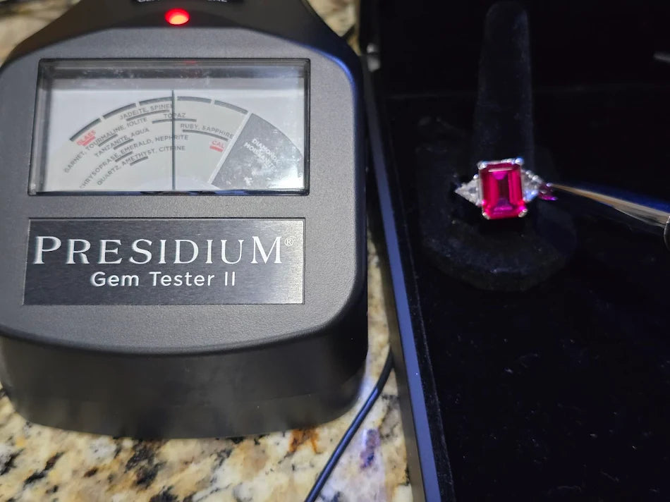 Silver-tone cocktail ring with emerald-cut red center stone and clear trillion side stones, view 8
