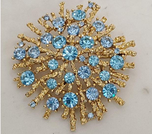 Signed Lisner gold-tone starburst brooch with blue rhinestones, view 2