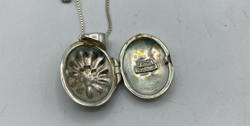 Sterling silver floral oval locket pendant marked 925 Thailand on chain, view 4