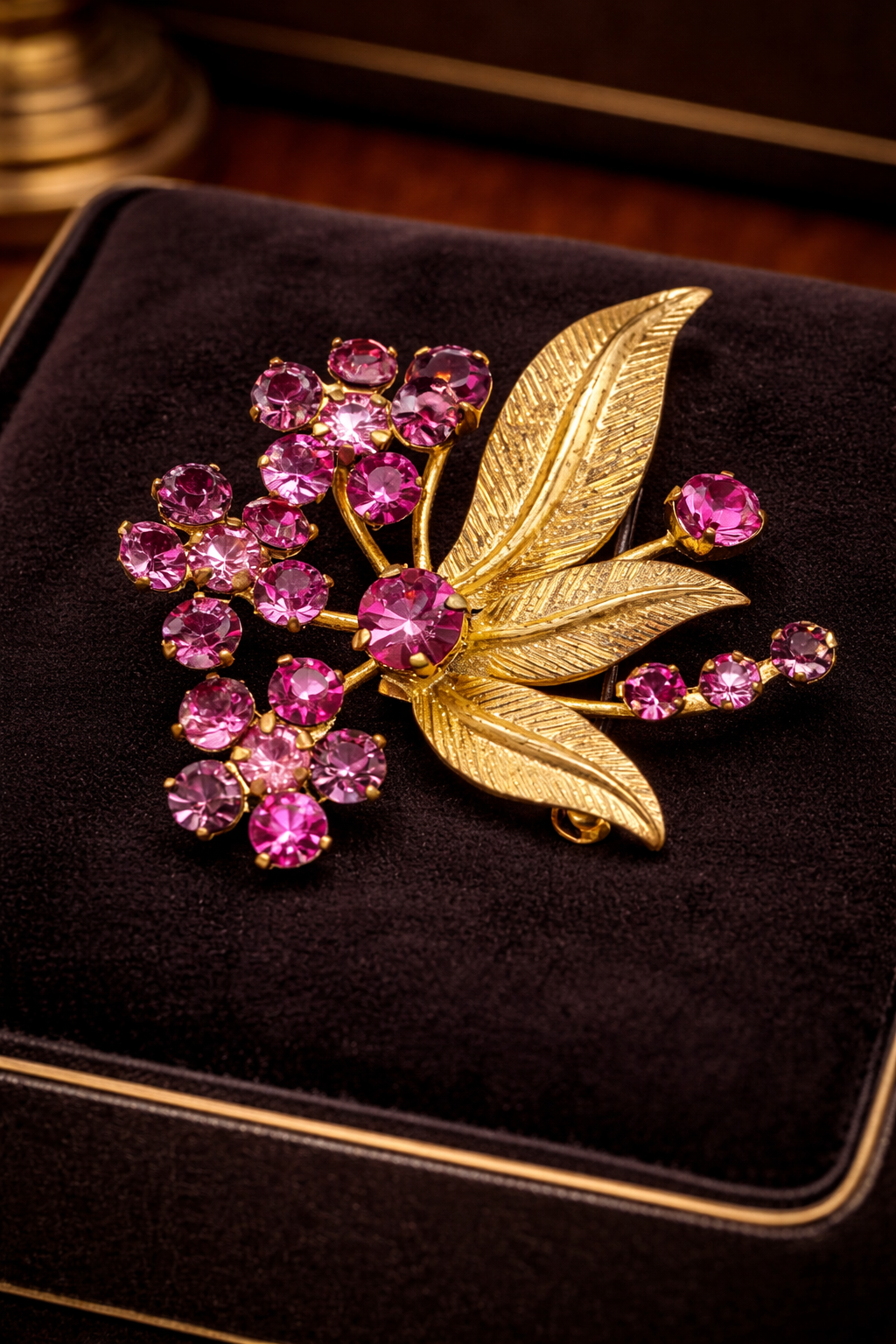 Made in Austria gold-tone flower brooch with pink rhinestones
