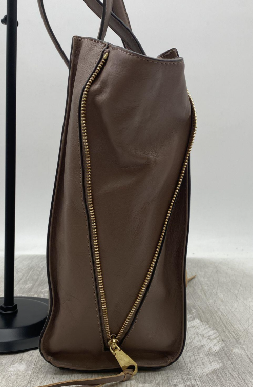 Brown pebbled tote handbag with top handles, zip top and slim side ties, view 6
