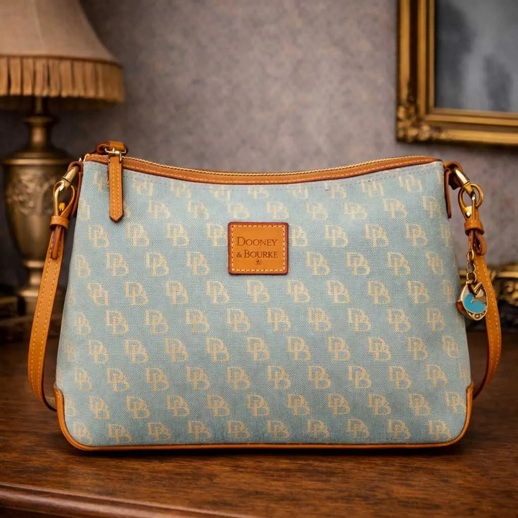Dooney and Bourke mint green DB monogram canvas pochette with tan leather trim