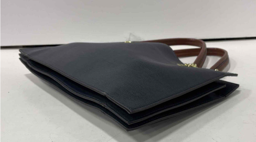 Navy blue textured leather tote with brown handles and gold-tone hardware, view 5