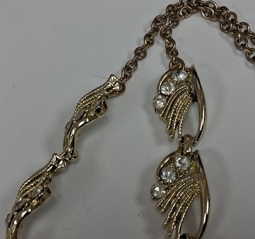 Gold-tone rhinestone statement necklace with leaf and scroll links, view 5