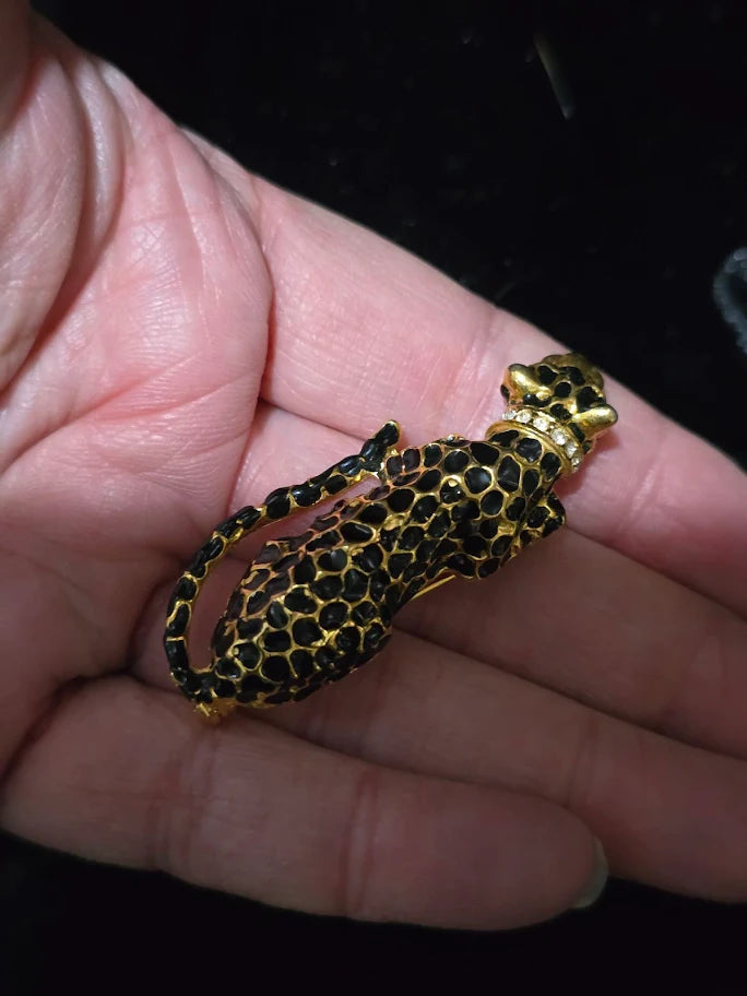 Black enamel reclining panther brooch with gold-tone detail and rhinestone collar, view 3