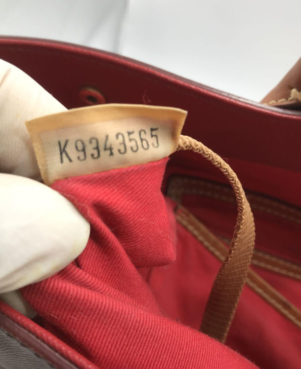 Dooney and Bourke large red pebbled leather shopper tote with tan rolled handles, view 7