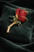 (SOLD) Vintage Monet Gold-Tone Red Rhinestone Rose Brooch with Green Enamel Leaves