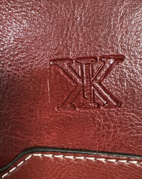 Deep red leather structured satchel with contrast stitching, top handles and crossbody strap, view 2
