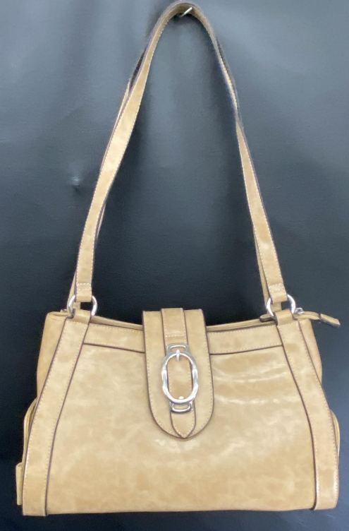 Beige shoulder bag with front buckle and side compartments holding mini pouches, view 4
