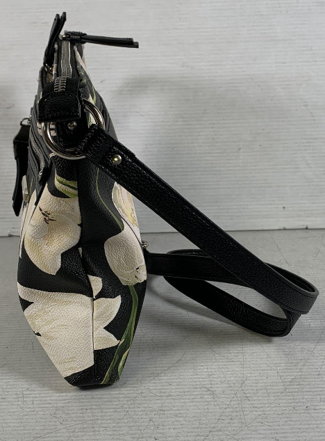 Black crossbody bag with large white floral pattern and front zip pocket, view 6