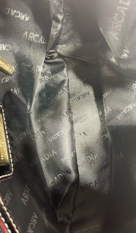 Black embossed patent leather shoulder bag with slim strap and gold-tone chain accents, view 5