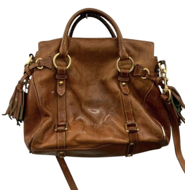 Brown leather satchel with rolled handles, tassel accents and shoulder strap, view 4