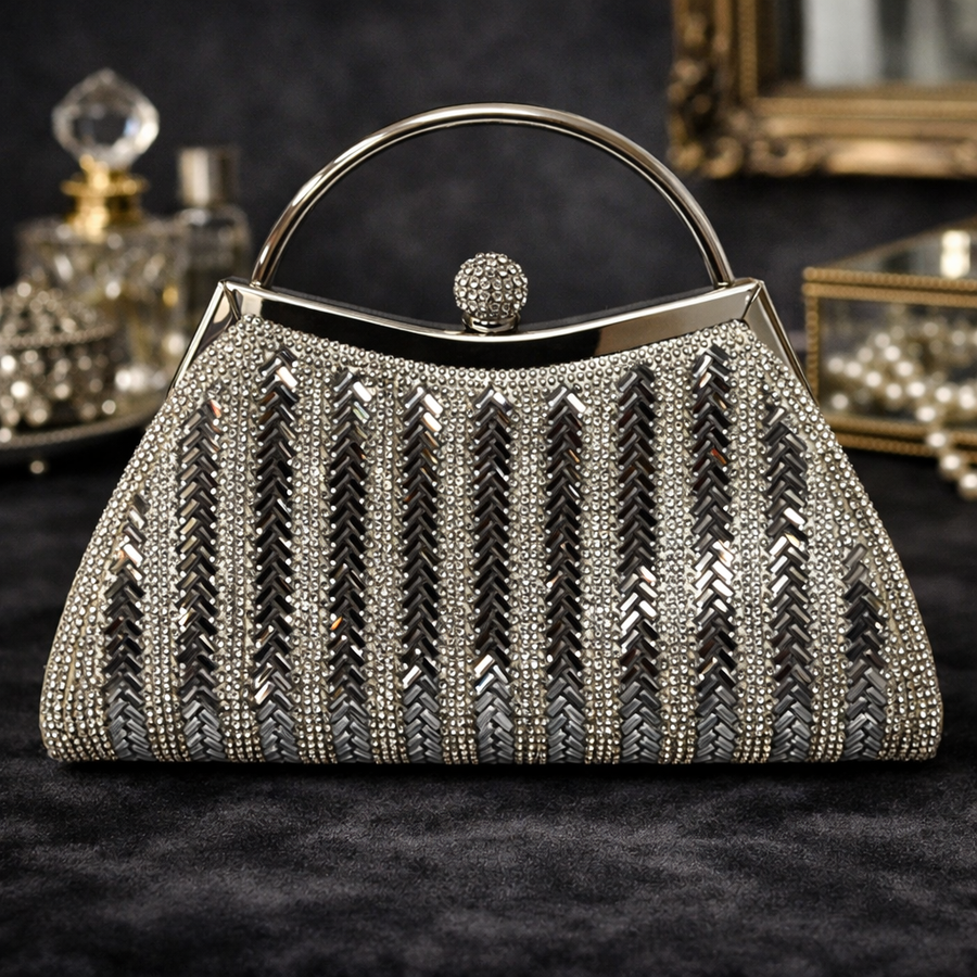 Silver rhinestone evening bag with top handle, kiss-lock frame and crystal-style sphere clasp