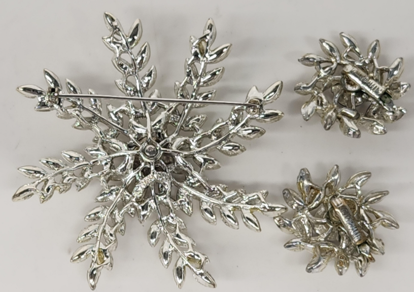 Signed Sarah Coventry silver-tone snowflake brooch and matching clip earrings with clear rhinestones, view 3