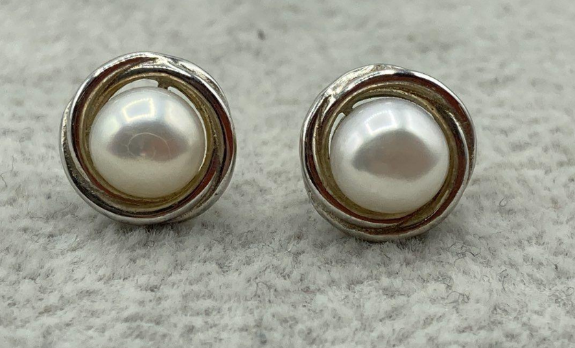 White faux pearl button stud earrings in rounded silver-tone bezel frames, view 2