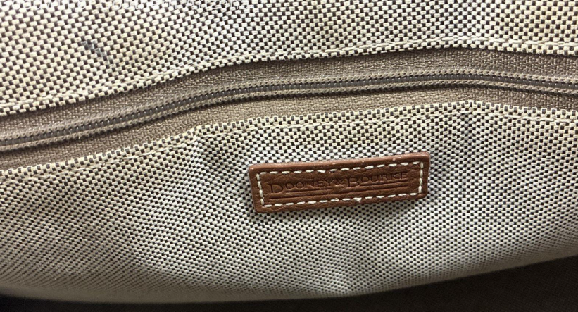 Dooney and Bourke brown pebbled All Weather Leather satchel with two front pockets and rolled handles, view 2
