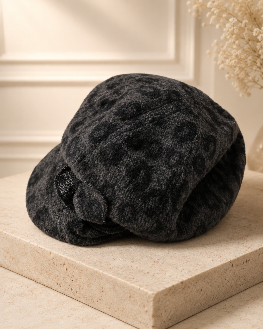 Gray and charcoal leopard print newsboy cap with short brim