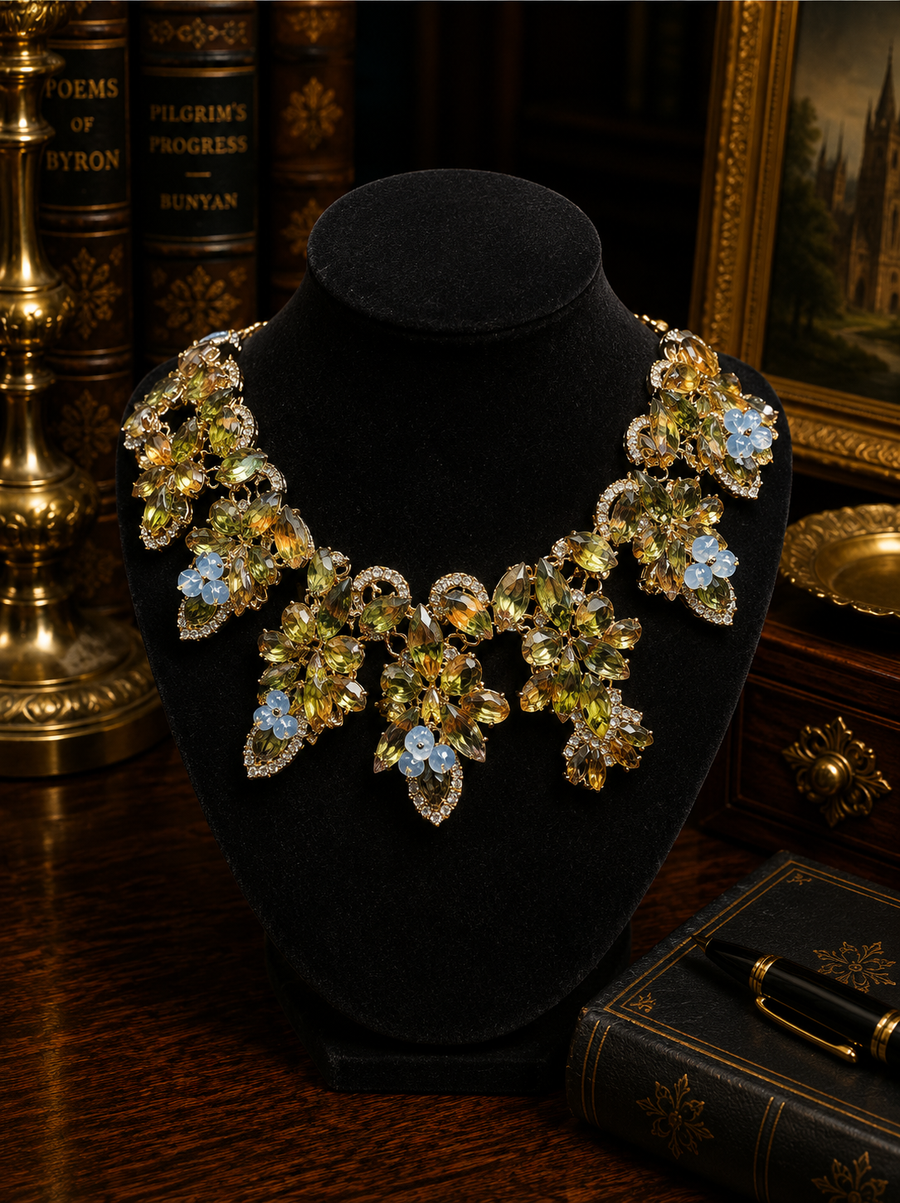 Gold-tone floral crystal statement collar necklace with blue, smoky gray and clear stones