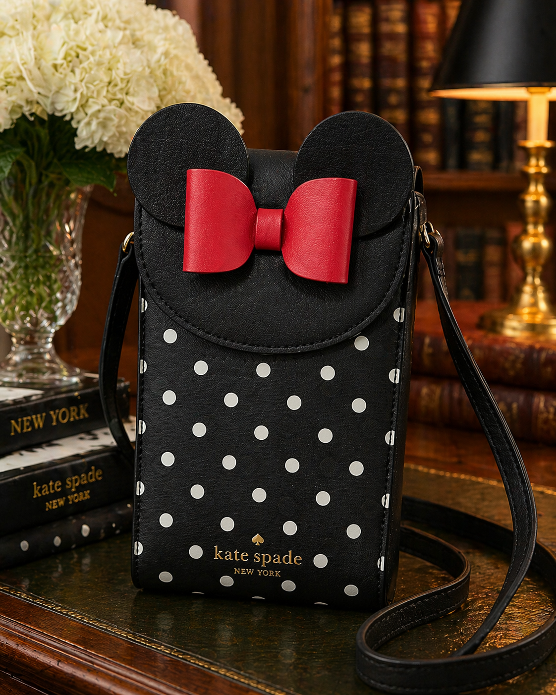 Black and white polka dot crossbody bag with Minnie Mouse ears and red bow