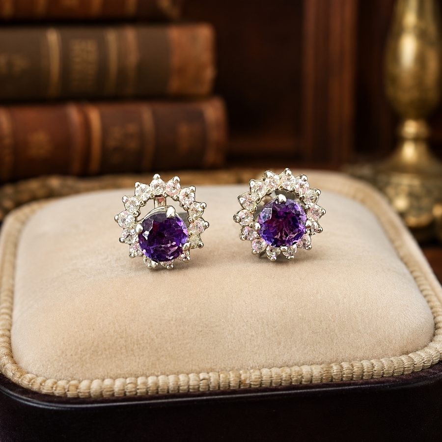 Halo stud earrings with purple center stones and clear accent stones