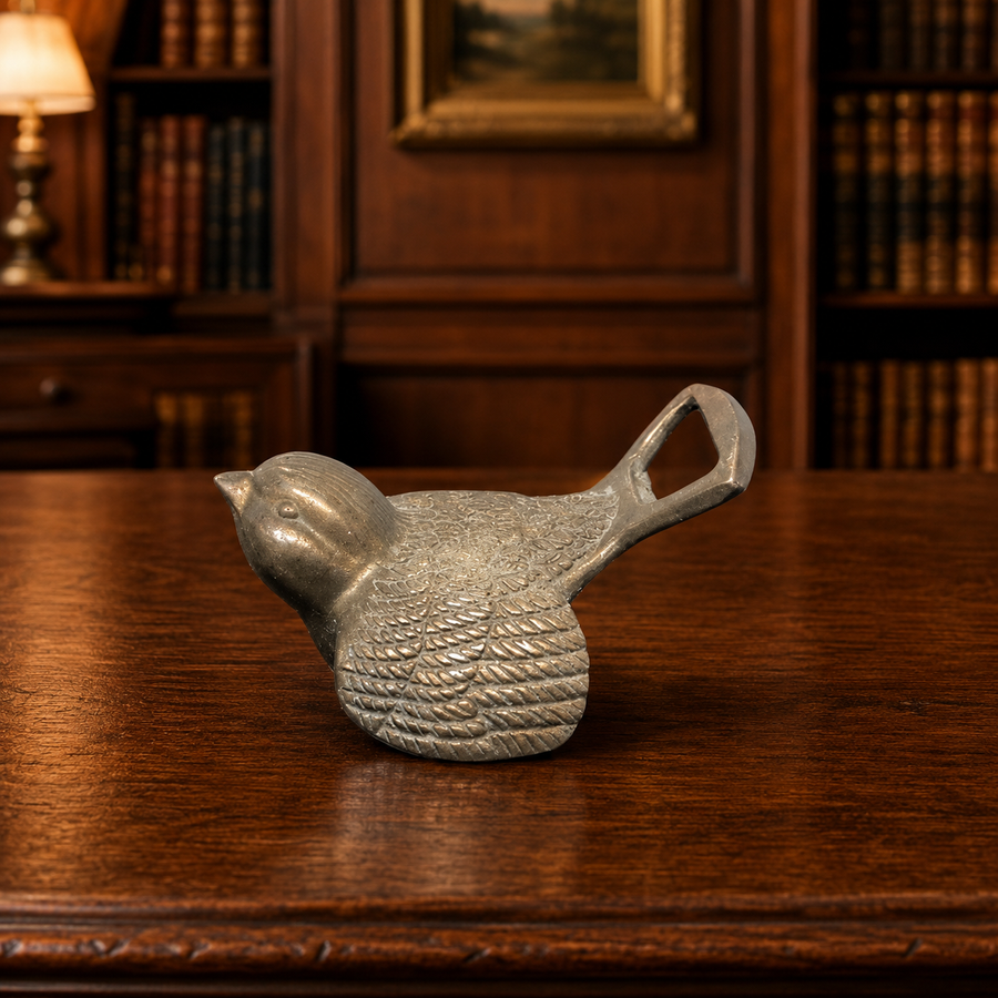 Silver-tone sparrow-shaped handheld bottle opener with textured feather detail