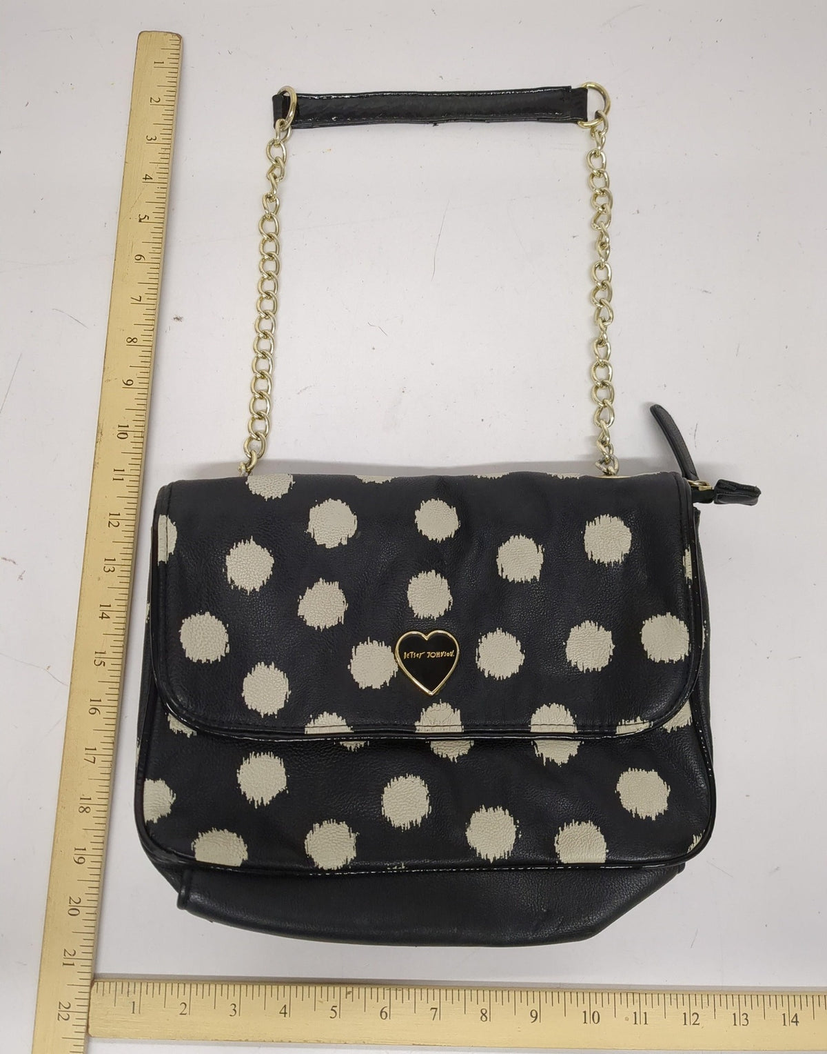 Black shoulder bag with large polka dots and gold-tone chain strap, view 5