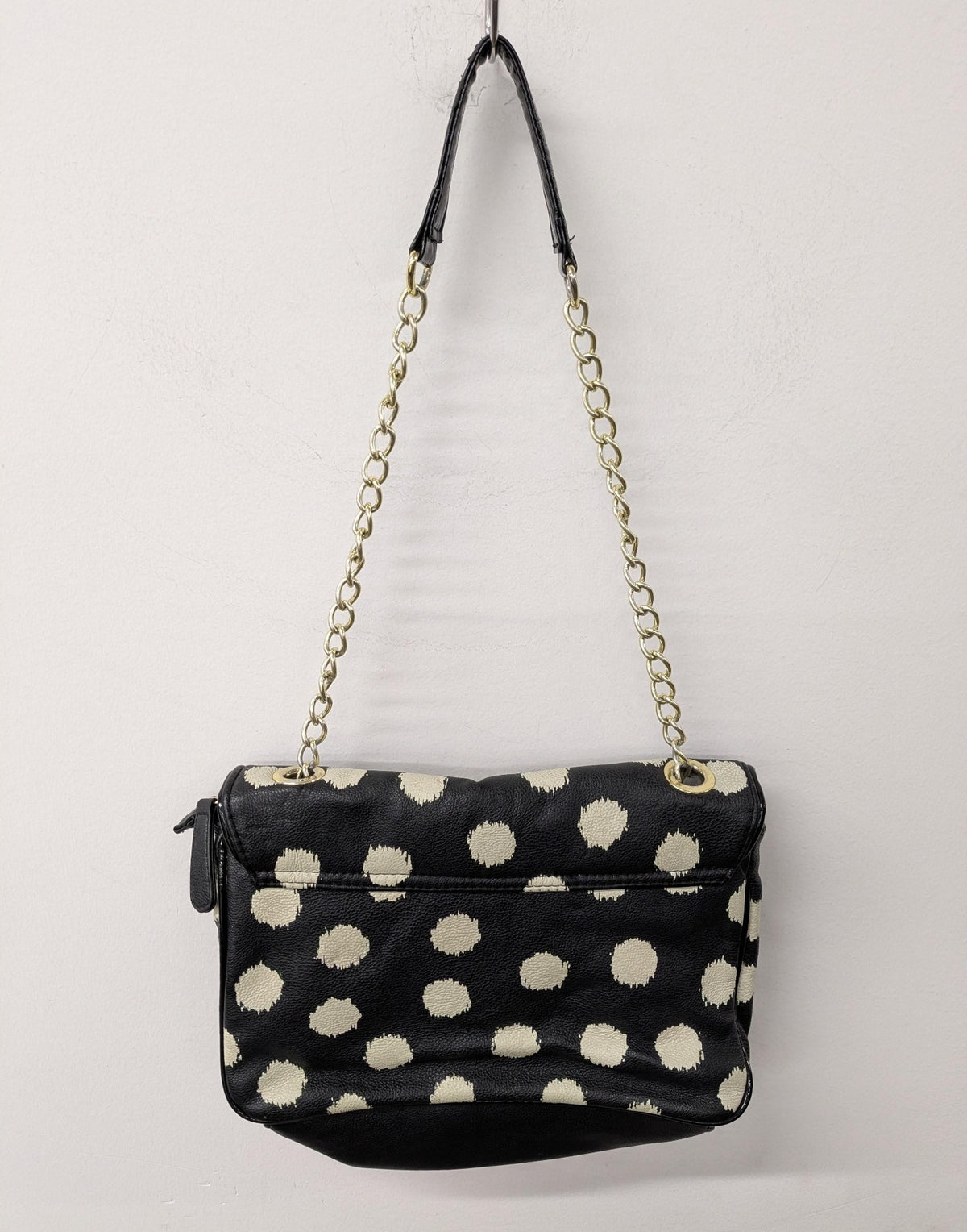 Black shoulder bag with large polka dots and gold-tone chain strap, view 6