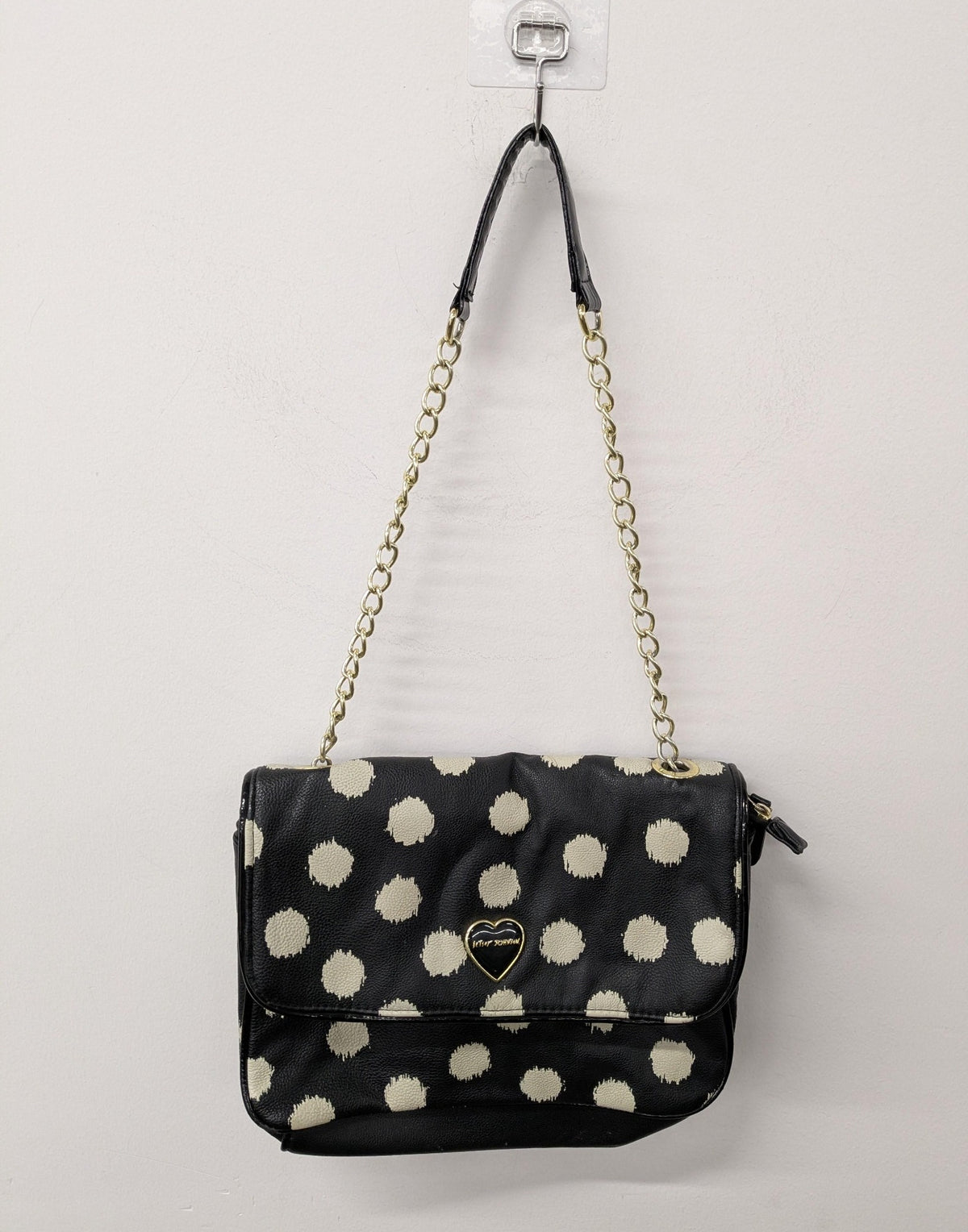 Black shoulder bag with large polka dots and gold-tone chain strap, view 7