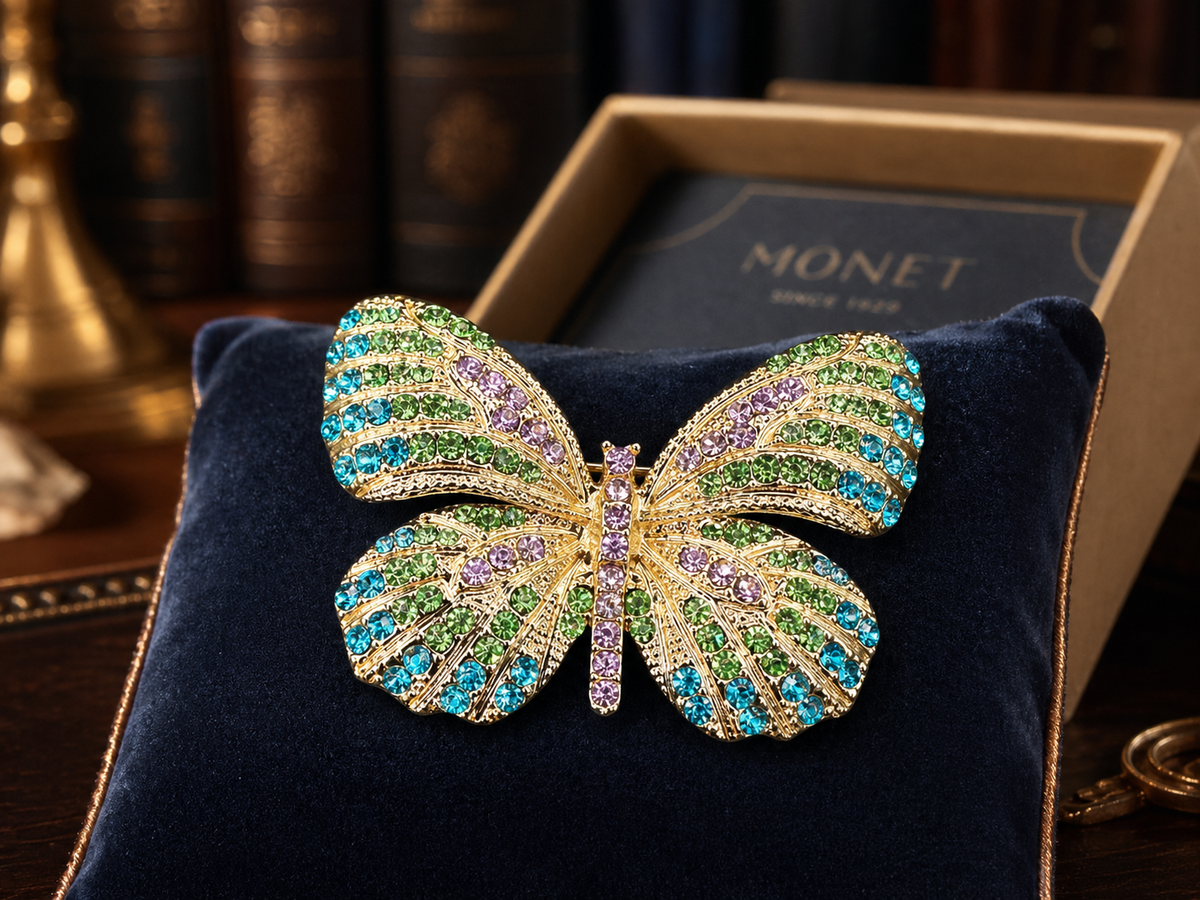 Monet gold-tone butterfly brooch with green, aqua and violet crystals, with Monet box