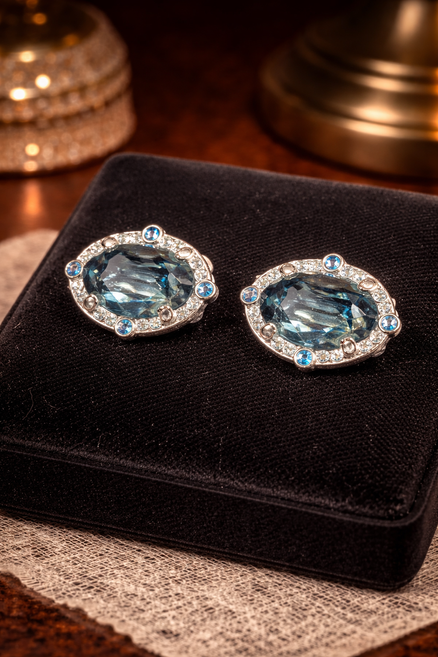 Swarovski silver-tone oval blue crystal clip earrings with clear and blue halo