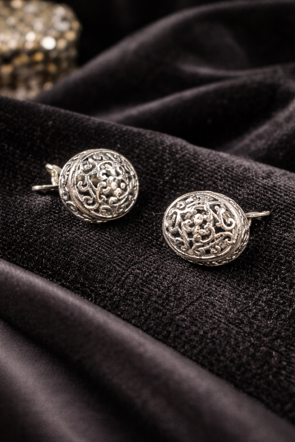 Silver-tone round dome stud earrings with openwork filigree scroll design