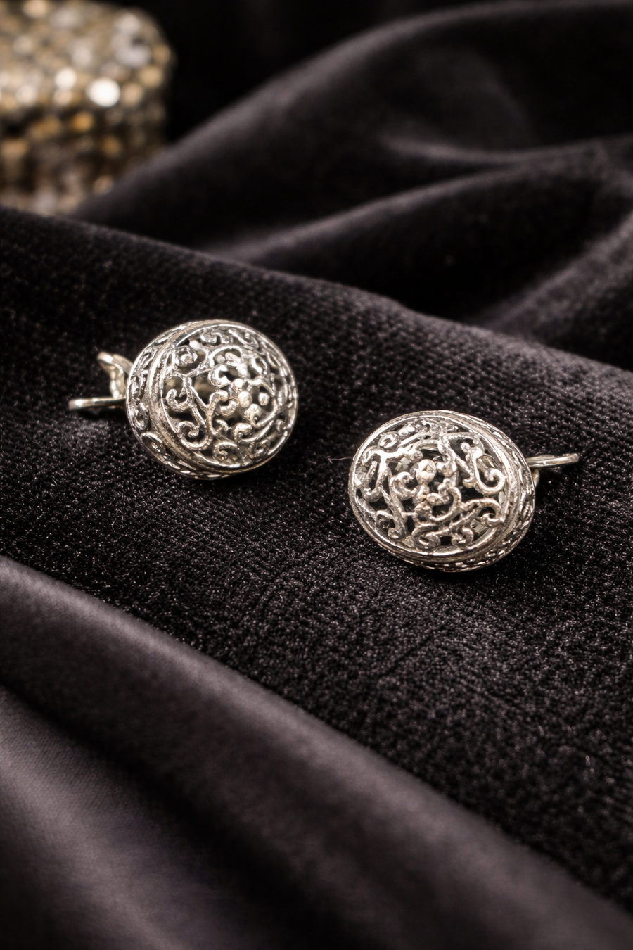 Silver-tone round dome stud earrings with openwork filigree scroll design