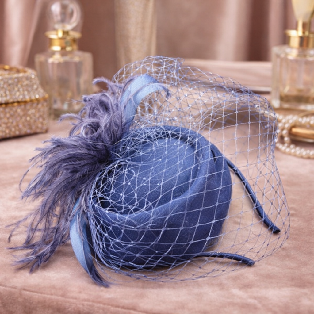 Blue felt pillbox hat with net veil and feather spray
