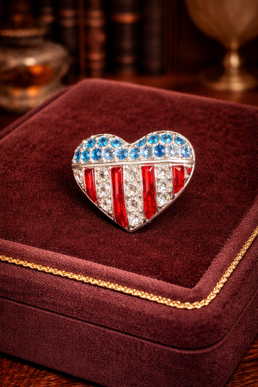 Swarovski heart-shaped American flag pin with blue and clear crystals and red enamel stripes