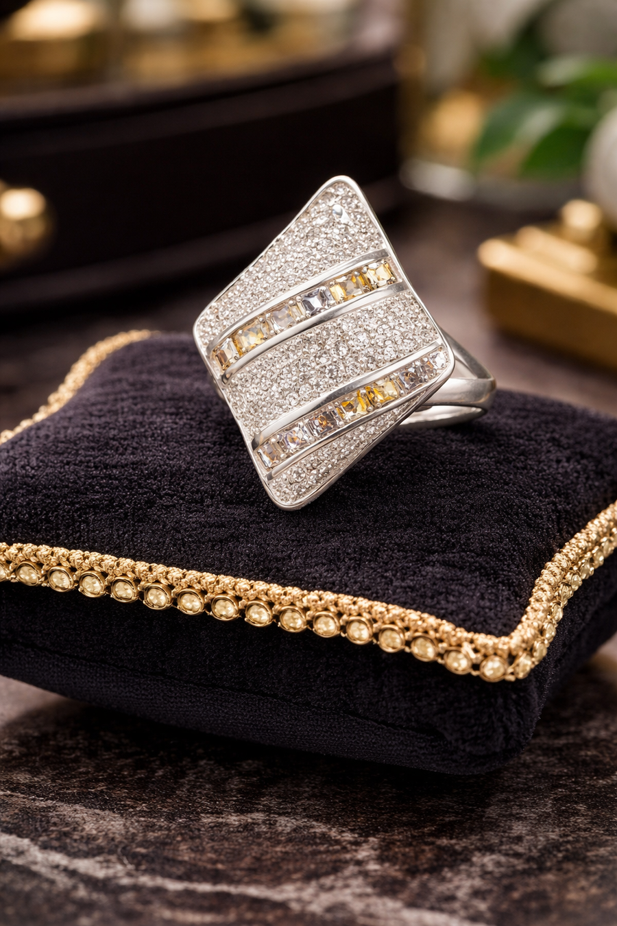 Geometric statement ring marked 925 with baguette and round pavé-style stones