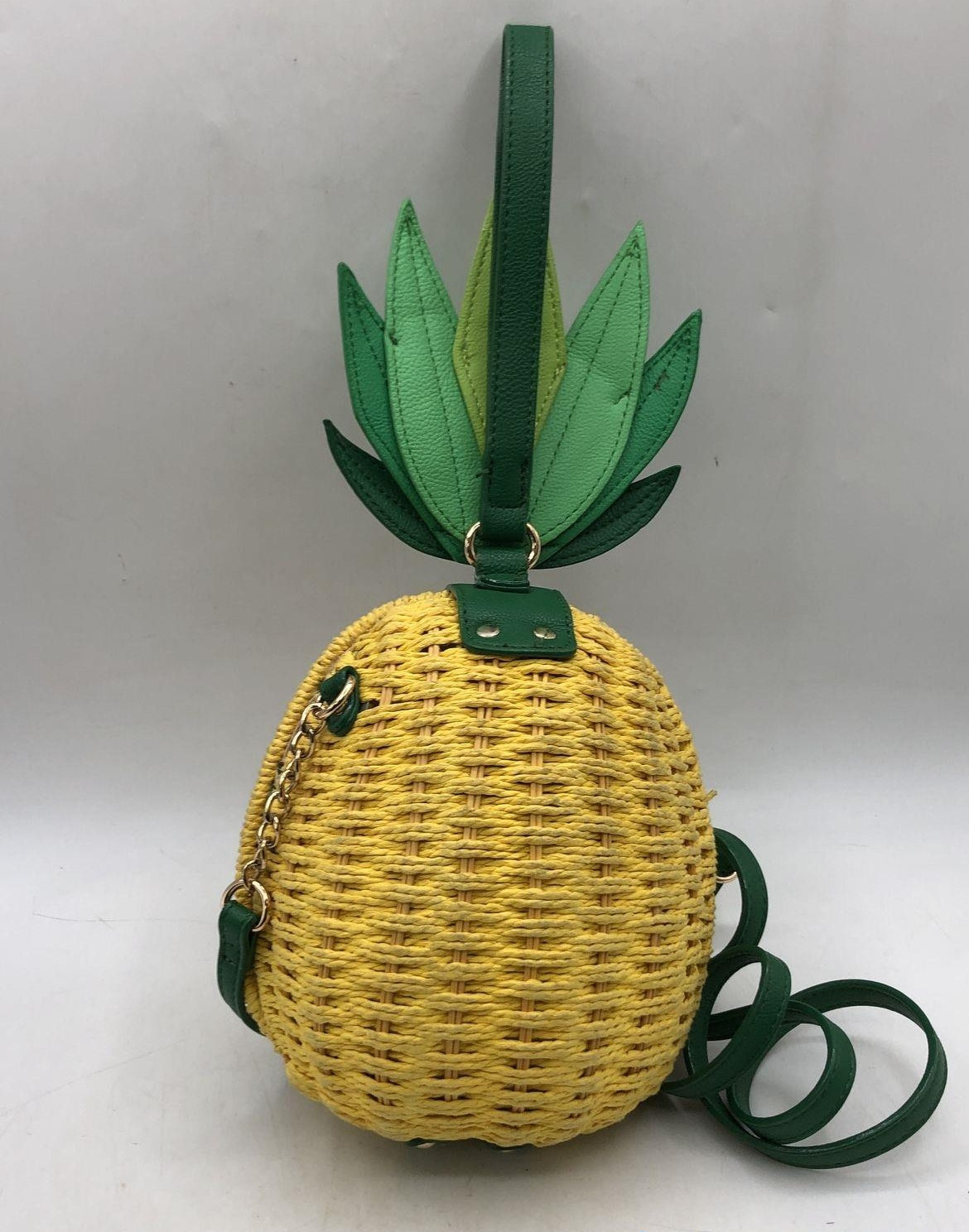 Pineapple-shaped crossbody bag with woven yellow body and green leaf top, view 4