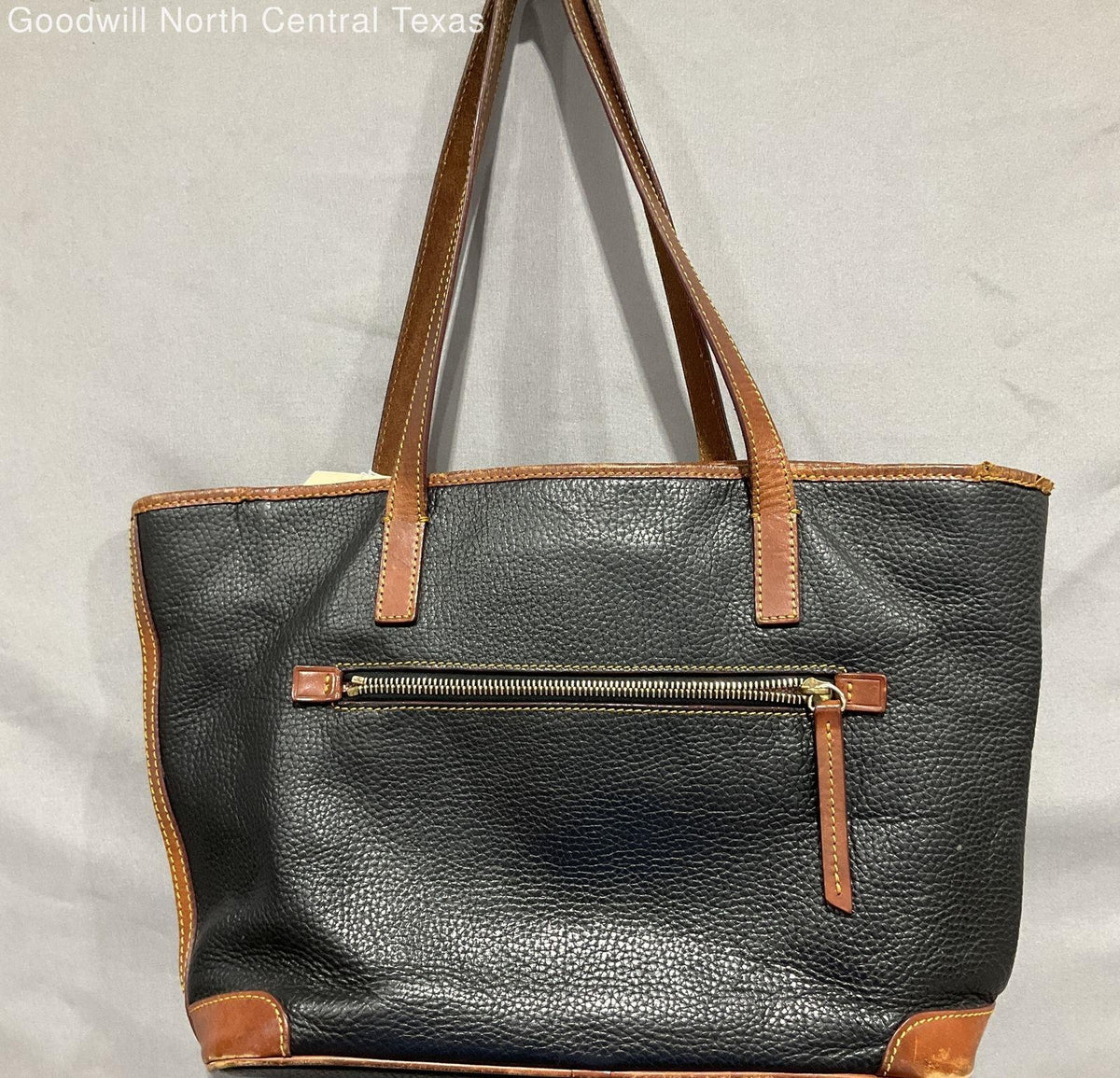 Black pebble grain shoulder bag with brown trim and long double straps, sold for repair or parts, view 2