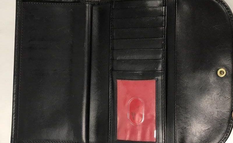 Beige monogram wallet with dark trim and rounded snap flap, view 3