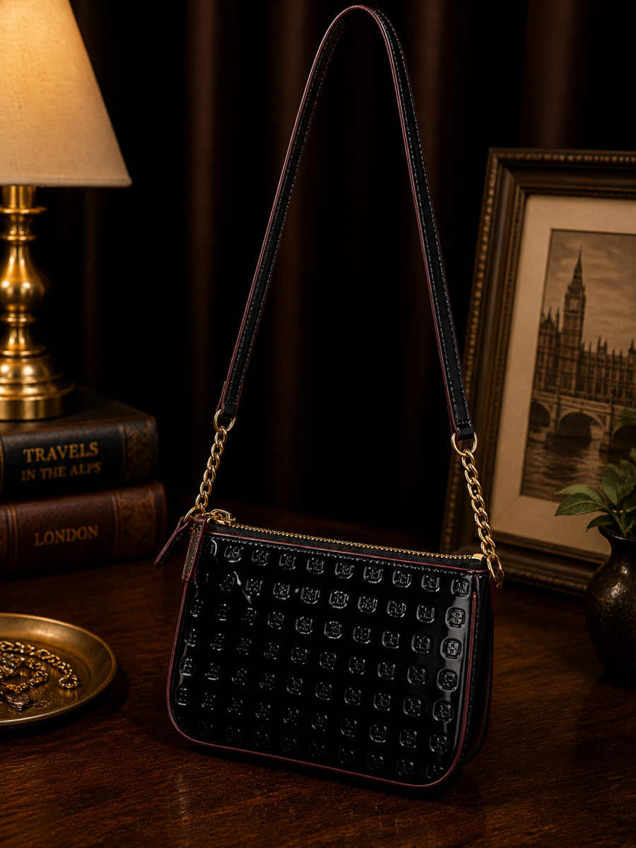 Black embossed patent leather shoulder bag with slim strap and gold-tone chain accents