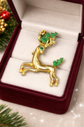 Vintage Christmas Gold Tone Reindeer Brooch with Green Enamel Holly and Red Rhinestone Accent