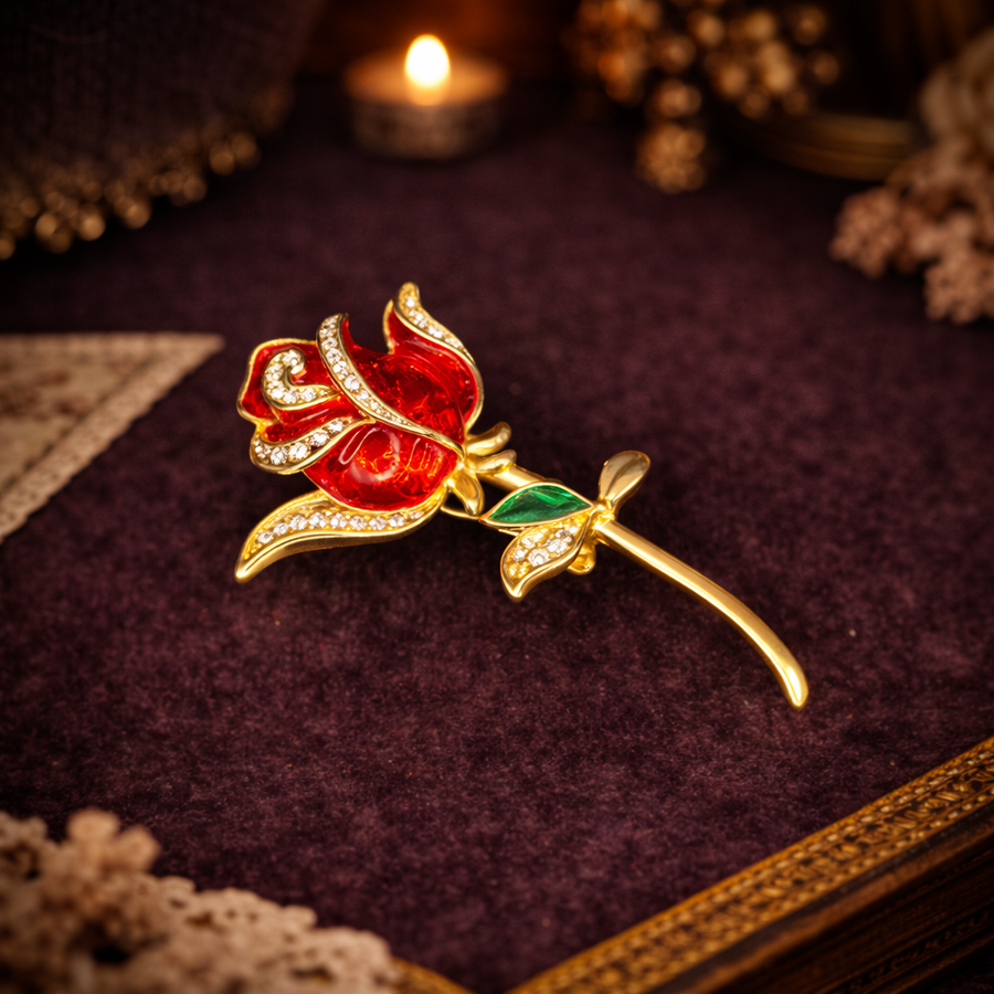 Signed Angel gold-tone long stem rose brooch with red enamel petals and clear rhinestones