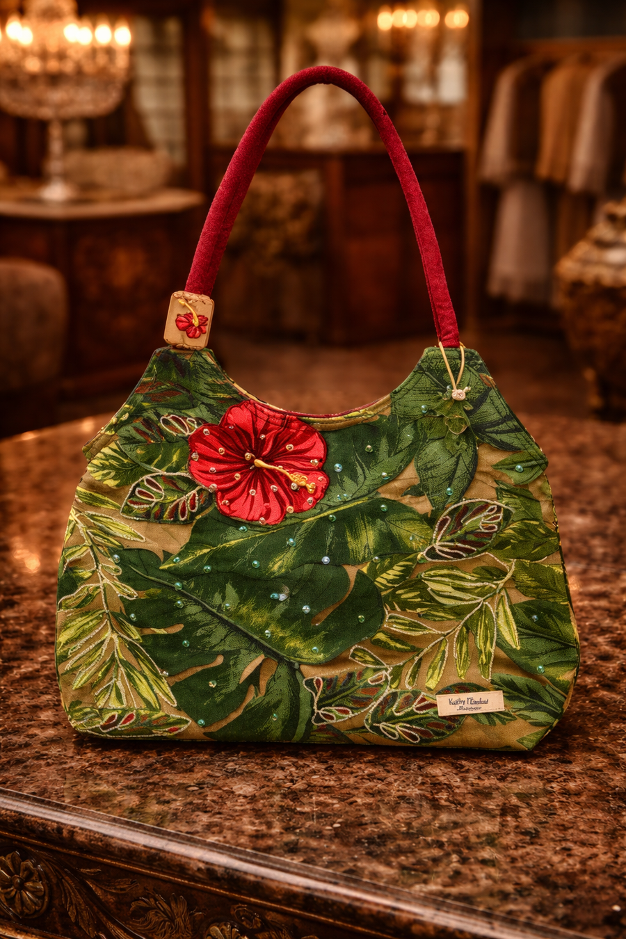 Tropical floral print shoulder bag with hibiscus flower accent