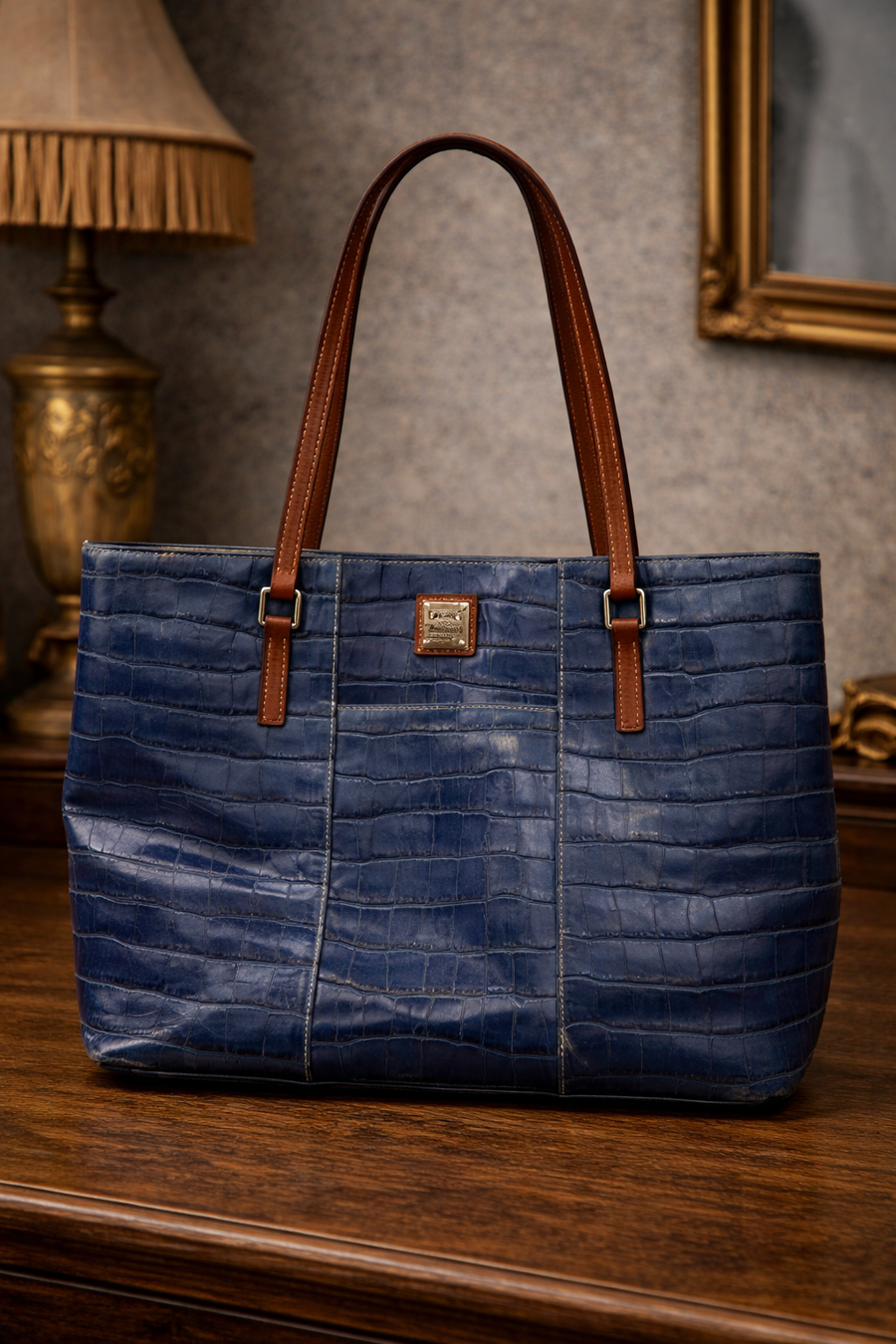 Dooney and Bourke blue croc-embossed leather tote with brown shoulder straps and red lining