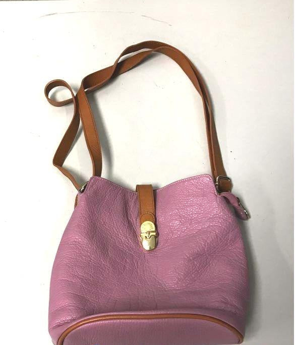 Pink lavender pebbled leather bucket-style crossbody bag with tan leather strap, view 5