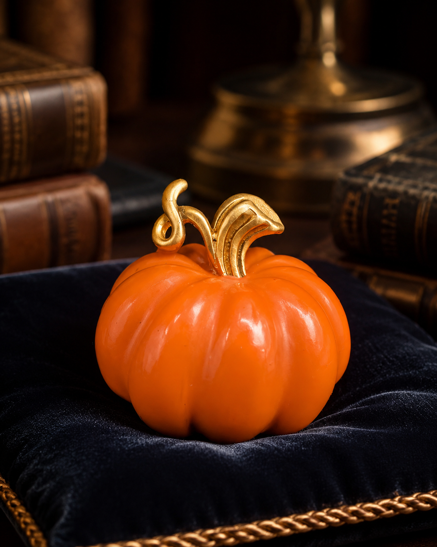 Gold-tone orange pumpkin brooch with sculpted stem