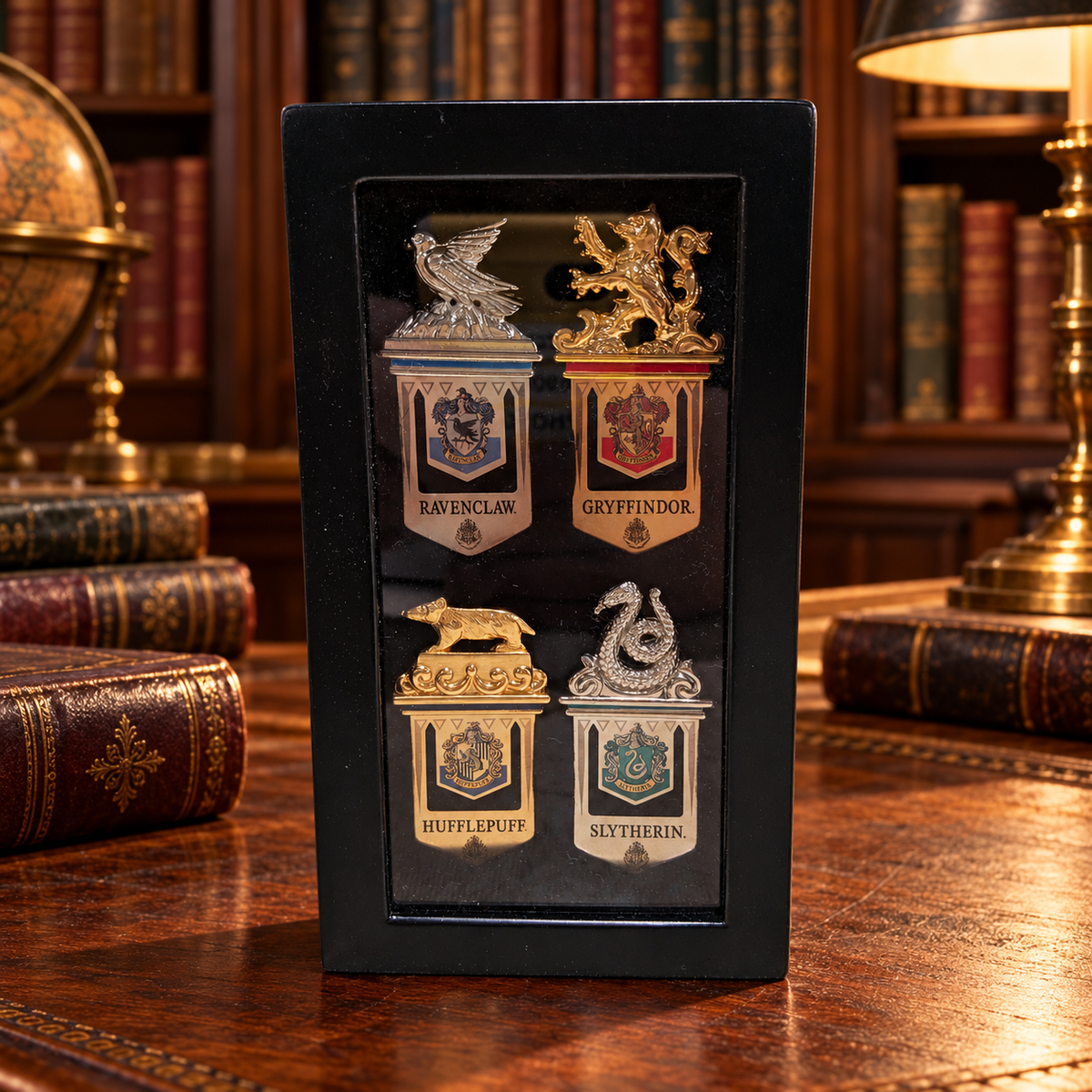 Four metal bookmarks with Hogwarts house crest designs