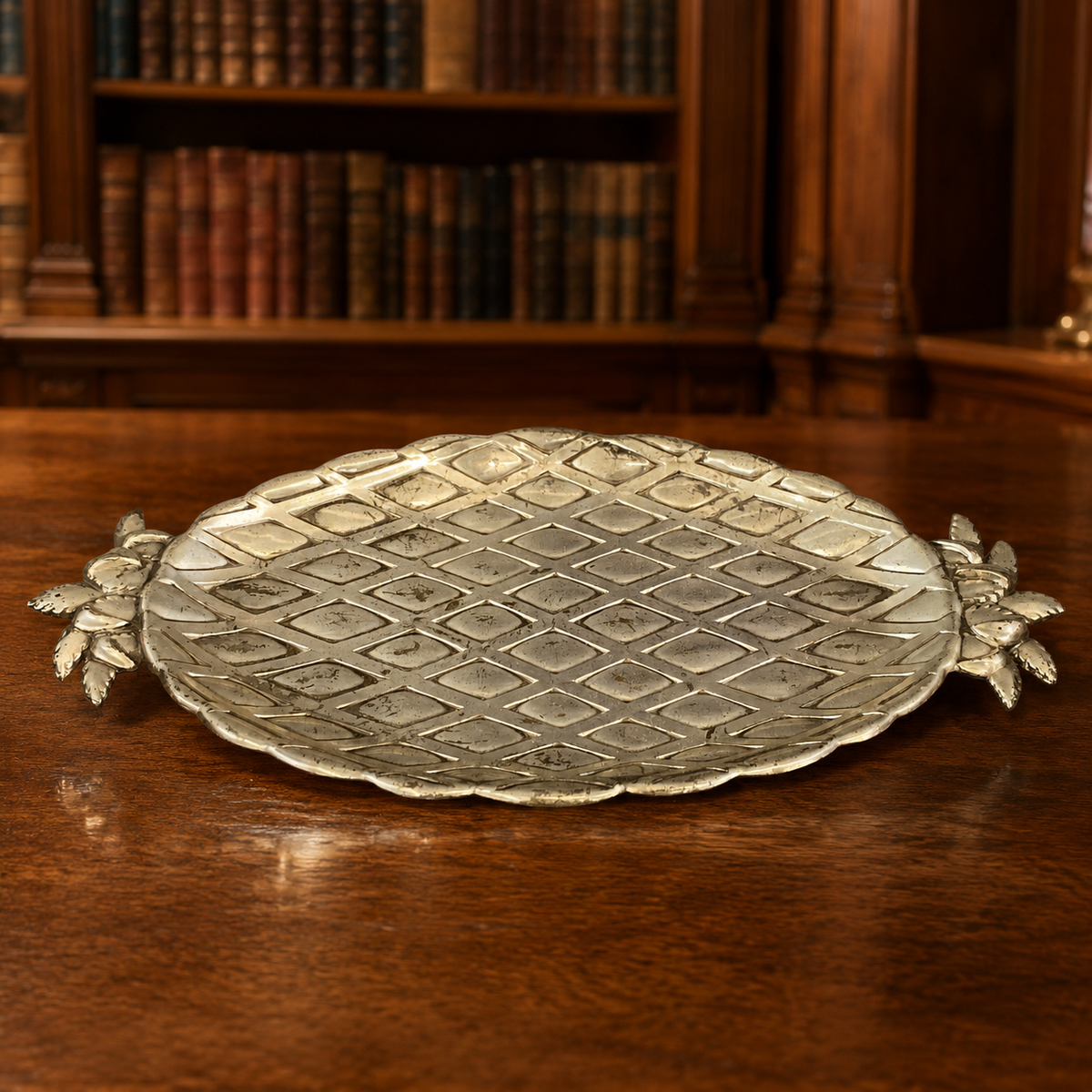 Silver-tone oval pineapple serving dish with diamond lattice well and leaf handles