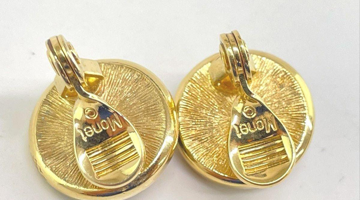 Monet round gold-tone clip-on earrings with domed purple centers and clear rhinestone halos, view 4
