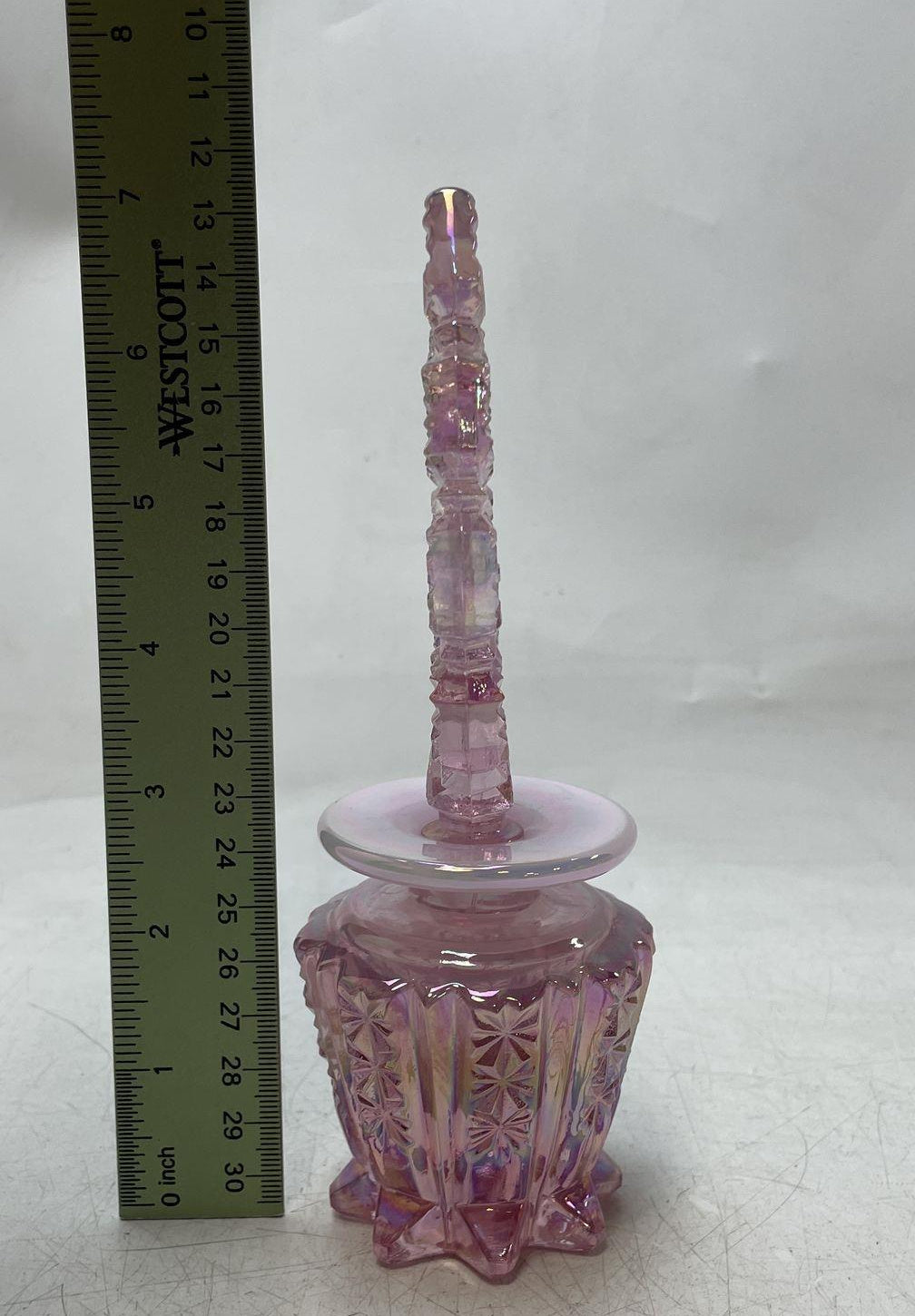 Pink iridescent carnival glass footed decanter with starburst panels and pierced oval stopper, view 3