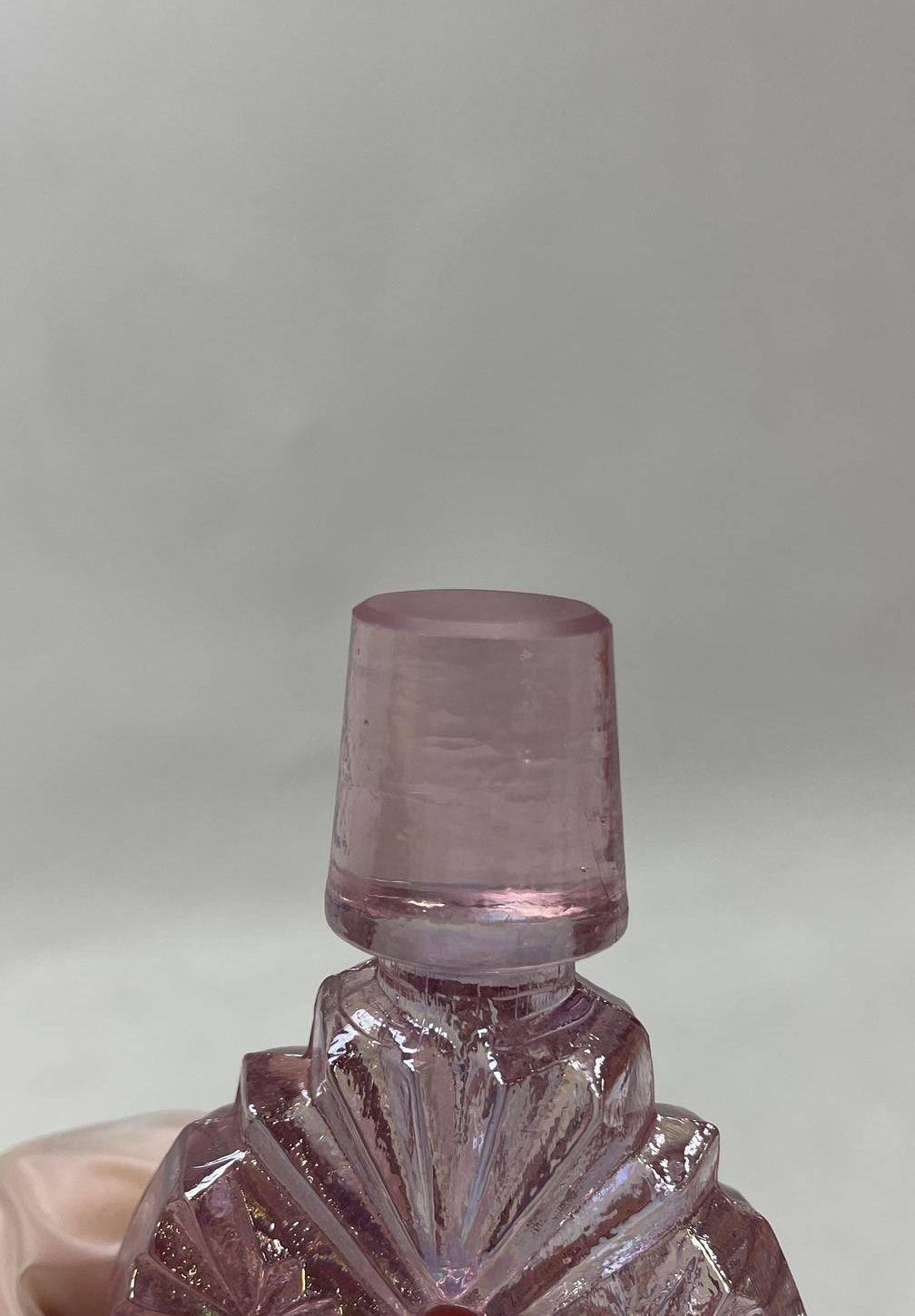 Pink iridescent carnival glass footed decanter with starburst panels and pierced oval stopper, view 6
